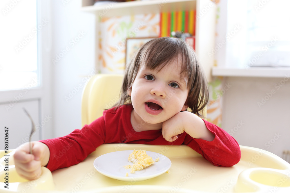 Toddler in red shirt with omelette Toddler in red shirt with omelette