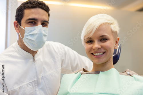 smiling caucasian dentist with blonde patient