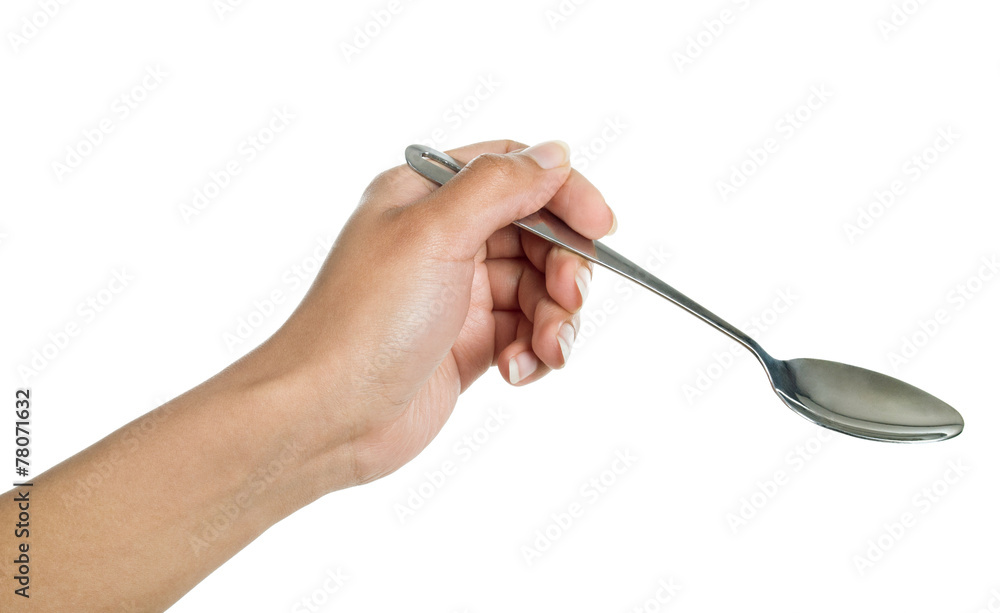 spoon in his hand on a white background spoon in his hand on a white background