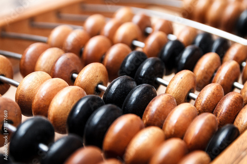 Old vintage abacus on a wooden table