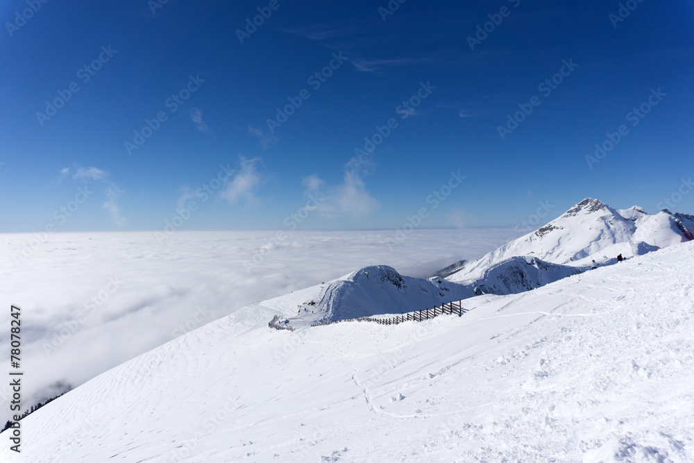 View on mountains and blue sky above clouds View on mountains and blue sky above clouds