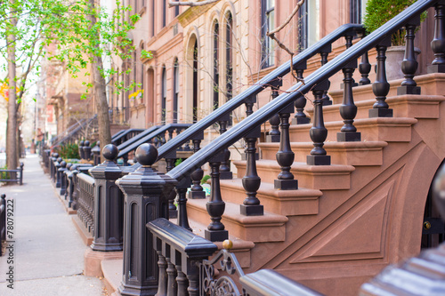 Old houses with stairs in the historic district of West Village photo