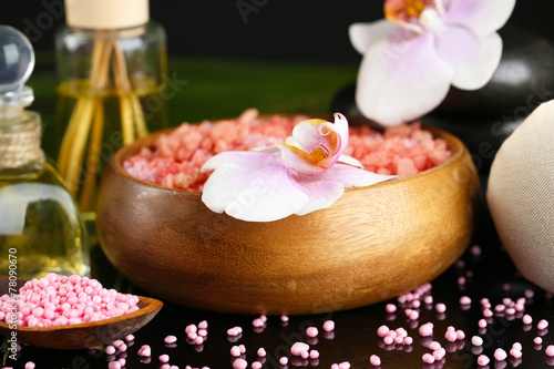 Fototapeta Naklejka Na Ścianę i Meble -  Beautiful spa composition with flowers on dark background