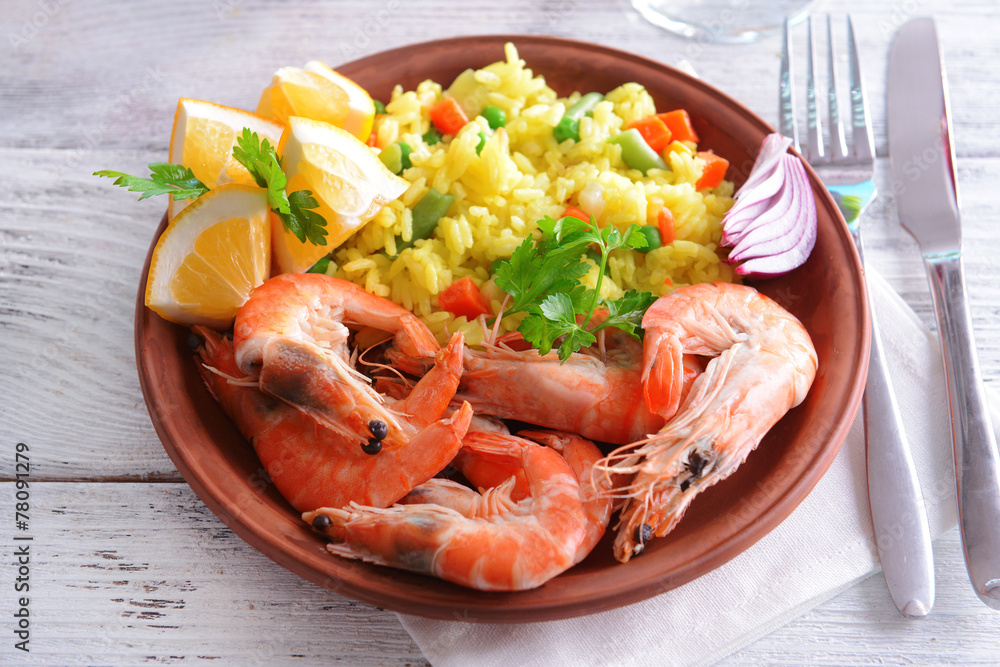 Seafood Paella on plate on table close-up Seafood Paella on plate on table close-up
