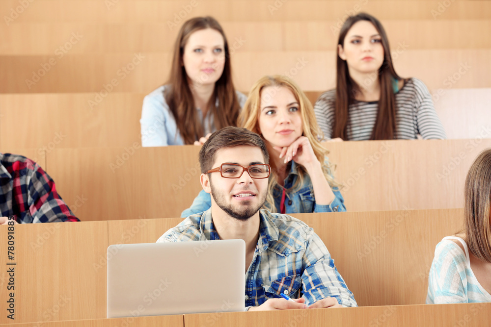 Group of students sitting in classroom Group of students sitting in classroom