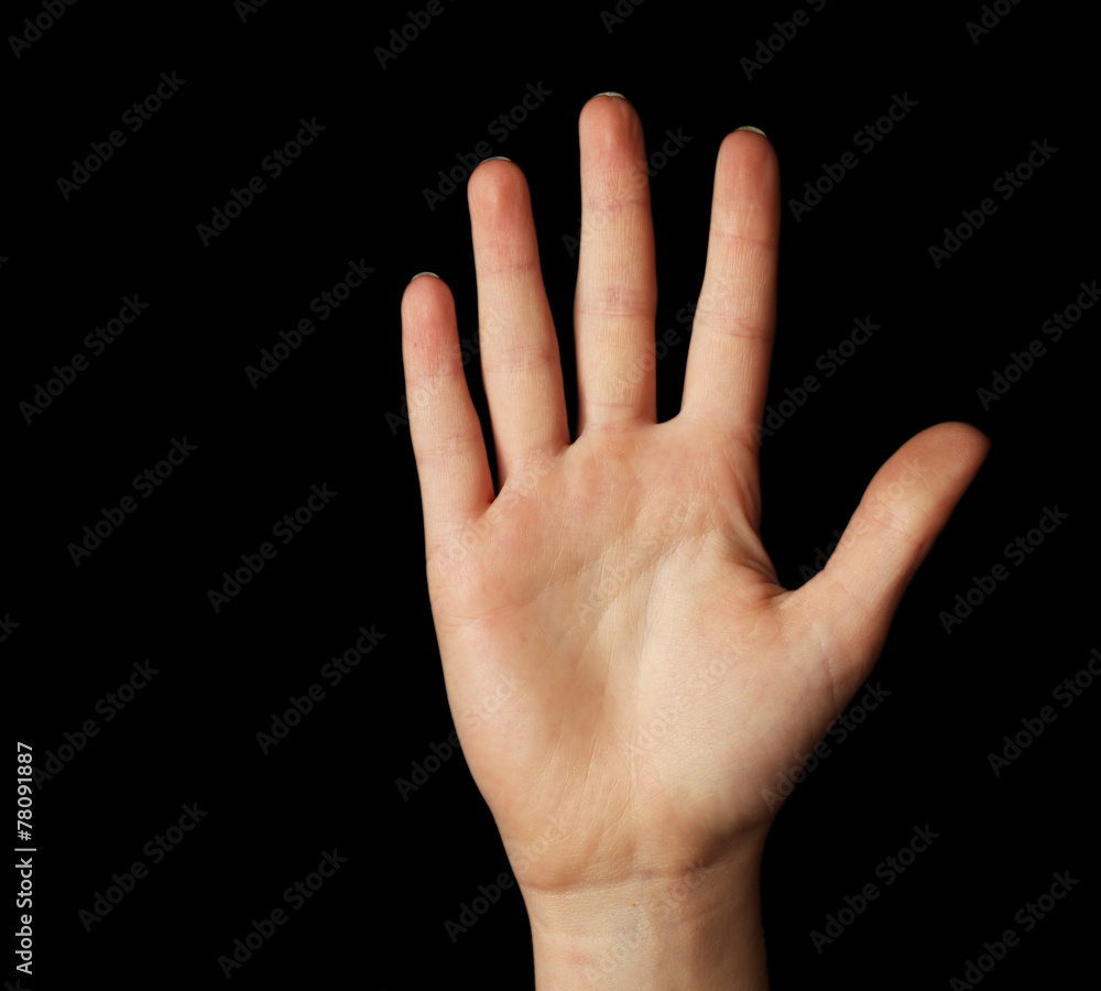 Female hand gesture on black background Female hand gesture on black background