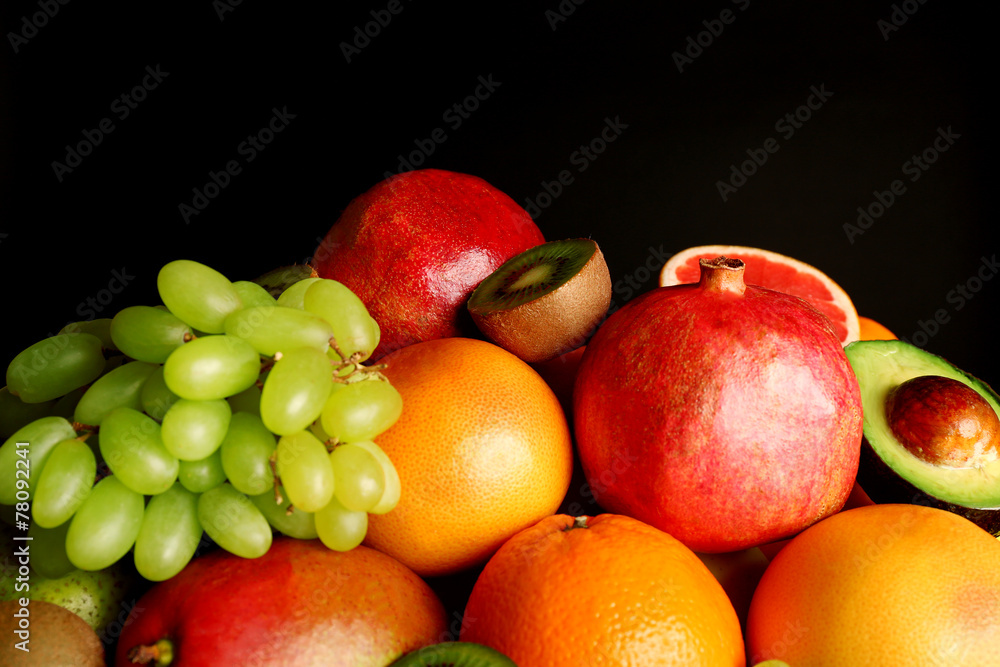 Assortment of fruits on black background
