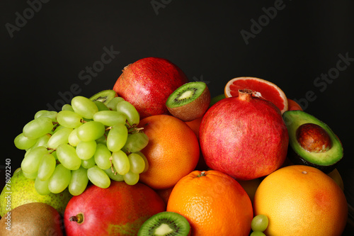Assortment of fruits on black background