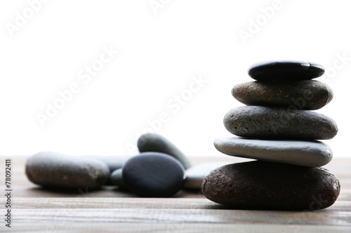 Spa stones on table on light background