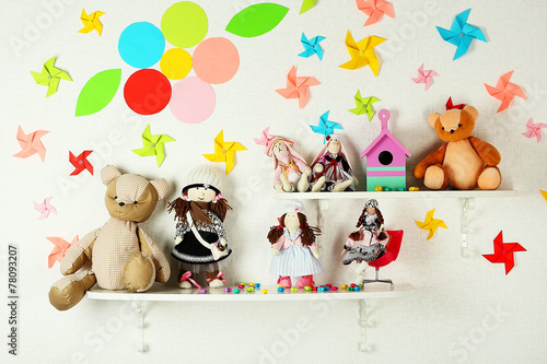 Fototapeta Naklejka Na Ścianę i Meble -  Shelves with toys in child room close-up