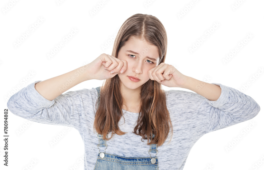 Sad young fashion girl in jeans overalls isolated Sad young fashion girl in jeans overalls isolated