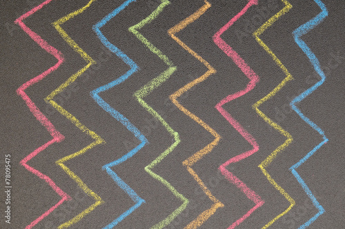 Hand drawn zig zag lines on chalkboard background