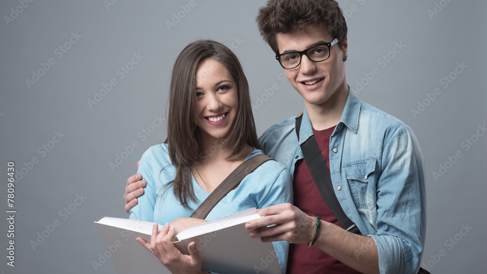 Smiling students studying together Smiling students studying together