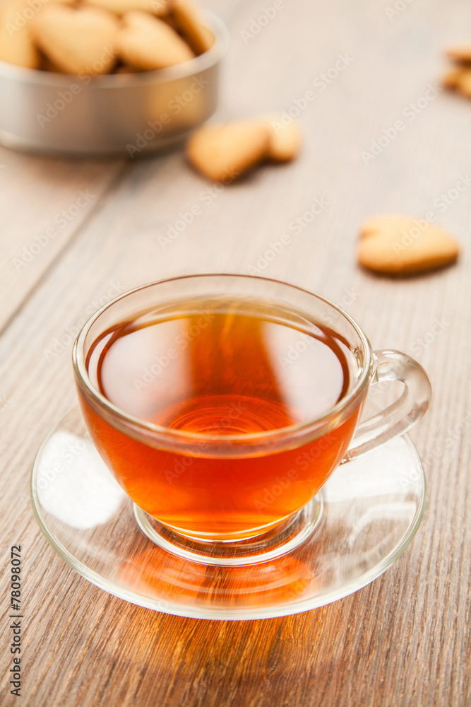 Glass cup of tea on a wooden table. Glass cup of tea on a wooden table.