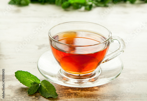 Cup of tea with mint leaves.