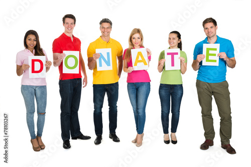 Group Of People Holding Letter Donate