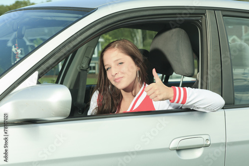 Car driver woman happy showing car keys out window © Louis-Photo