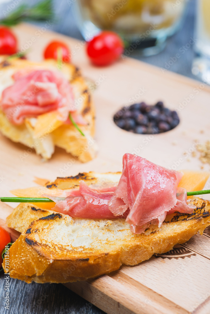 traditional Spanish tapas with slices of hamon and melon on a traditional Spanish tapas with slices of hamon and melon on a