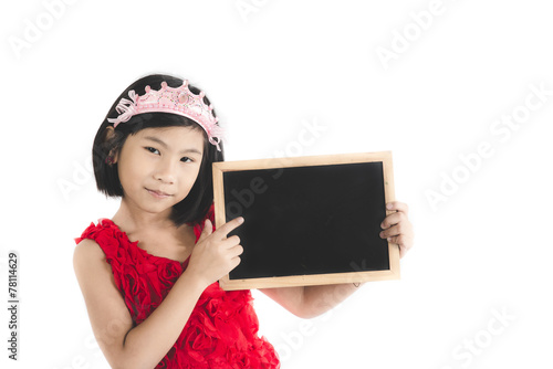 Cute Asian girl in red dress holding blank blackboard isolated o photo