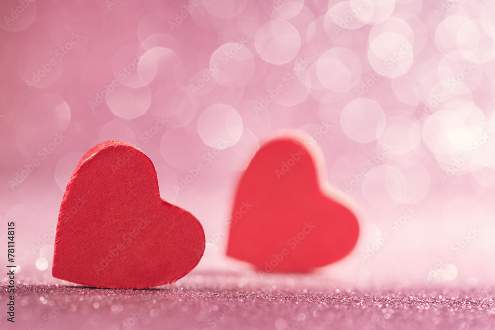 Obraz premium Red hearts over abstract glitter background
