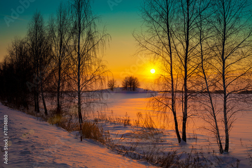 Sunset over snowy field © vvvita
