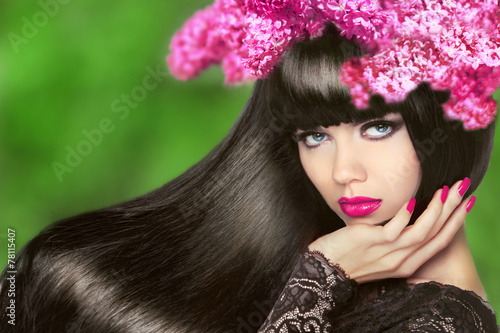 Attractive Brunette Girl with Flowers Long Hair. Healthy Black H photo