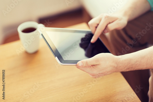 close up of man with laptop and cup at home