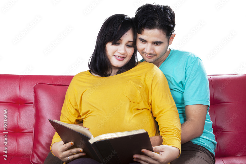 Man read a book with pregnant wife Man read a book with pregnant wife