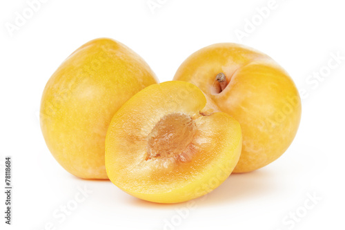 three ripe yellow plums