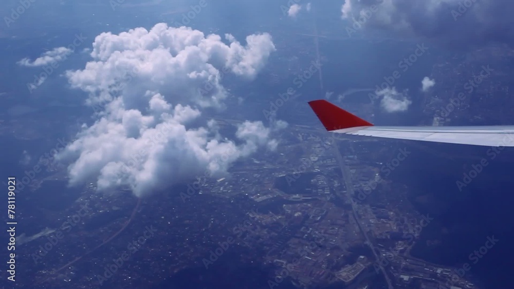 View on sky and clouds. Wing of airplane from window. HD View on sky and clouds. Wing of airplane from window. HD
