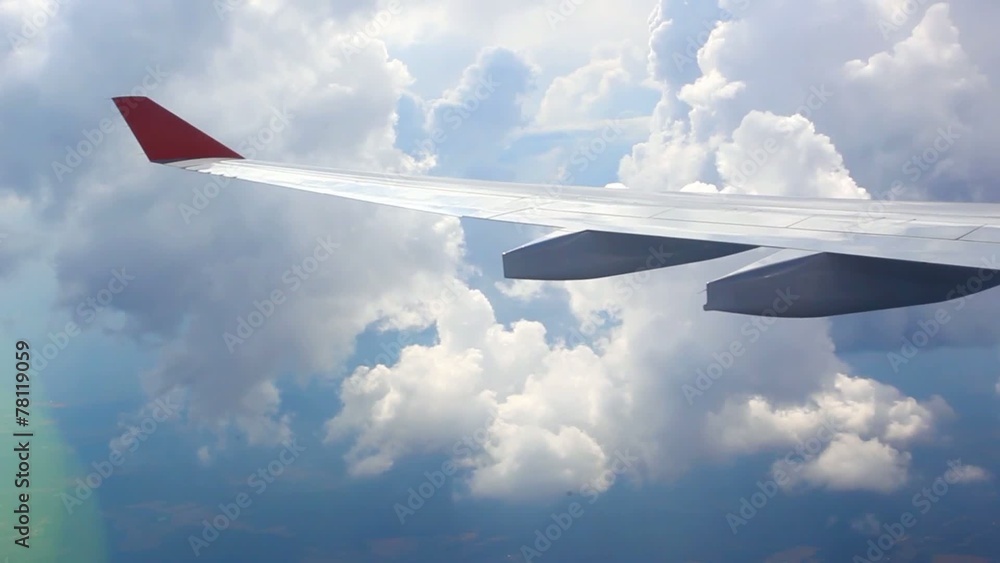 View on sky and clouds. Wing of airplane from window. HD View on sky and clouds. Wing of airplane from window. HD