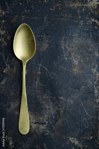 Single golden spoon
