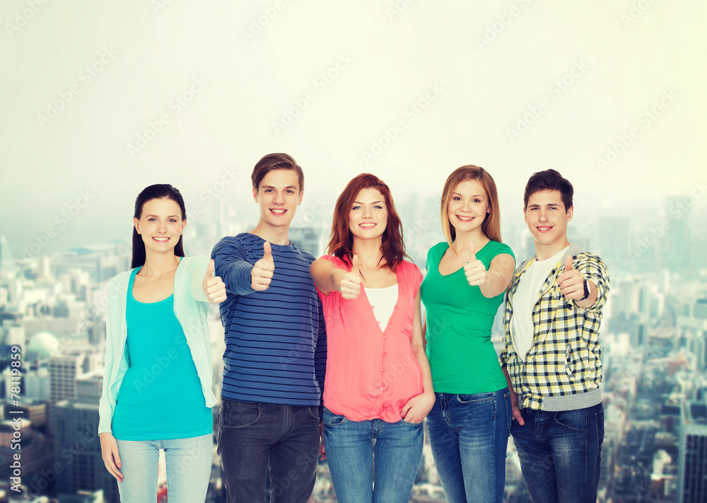 group of smiling students showing thumbs up group of smiling students showing thumbs up