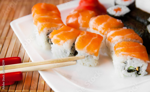 Roll with Cream Cheese and Cucumber inside. Salmon topped