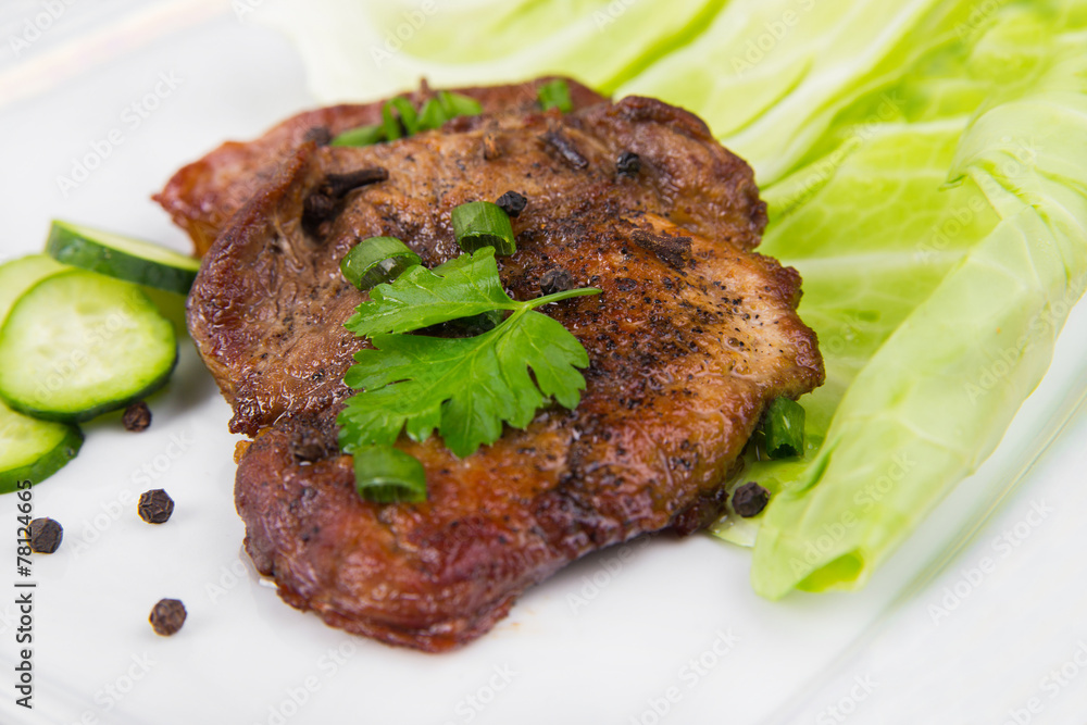 tasty grill meat with sauce and green on white plate