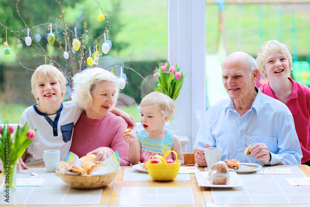 Grandparents with grandchildren enjoying Easter breakfast