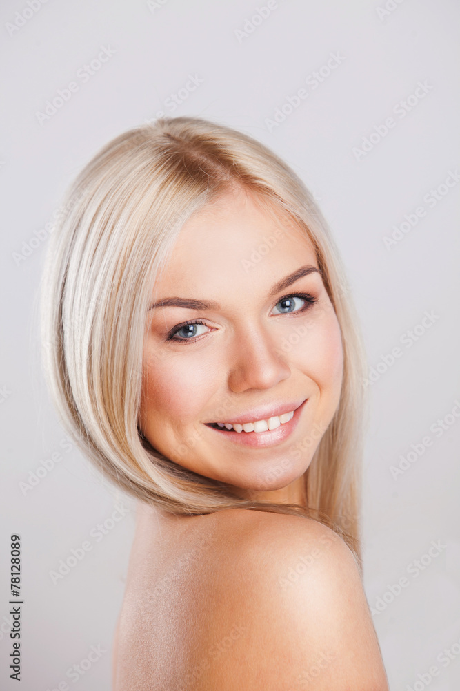 Beautiful young woman smiling with healthy clean skin Beautiful young woman smiling with healthy clean skin