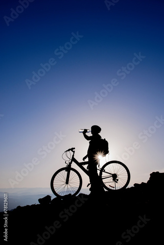 Cyclist drinking water.