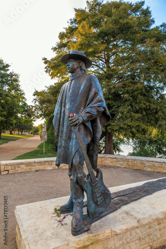 Stevie Ray Vaughan statue in front of downtown Austin and the Co photo