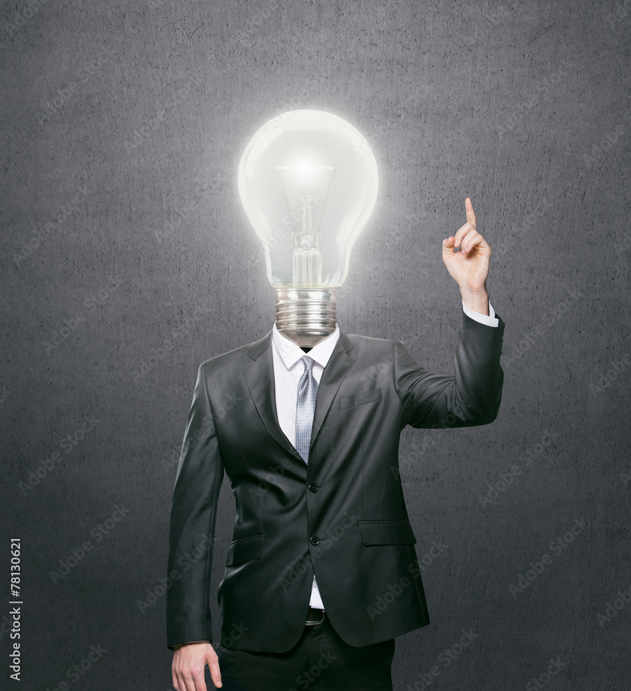 Businessman with lit light bulb as a head, idea concept Businessman with lit light bulb as a head, idea concept
