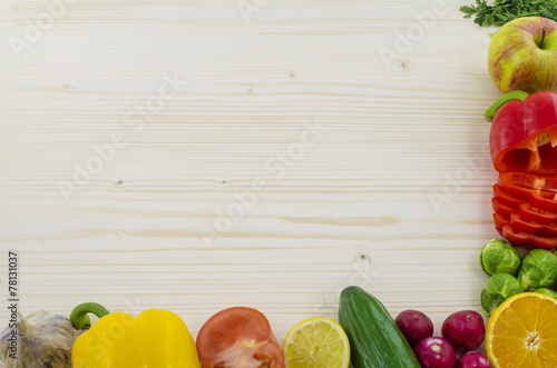 Frame of vegetables on wooden table. Background