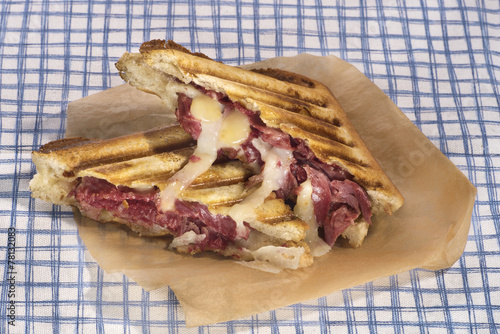 Grilled pastrami sandwich with melted cheese