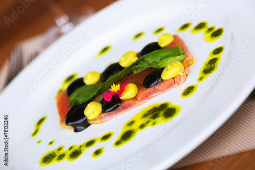  tuna steak with sauce on plate