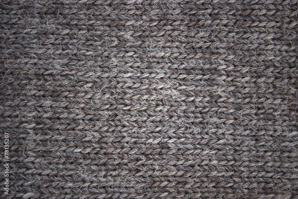 gray background of knitted woolen braids knitting stitch gray background of knitted woolen braids knitting stitch