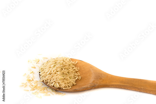 Brown Rice on Wood Ladle .