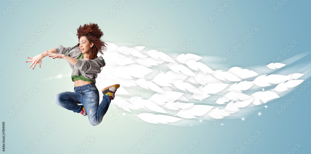 Healthy young woman jumping with feathers around her Healthy young woman jumping with feathers around her