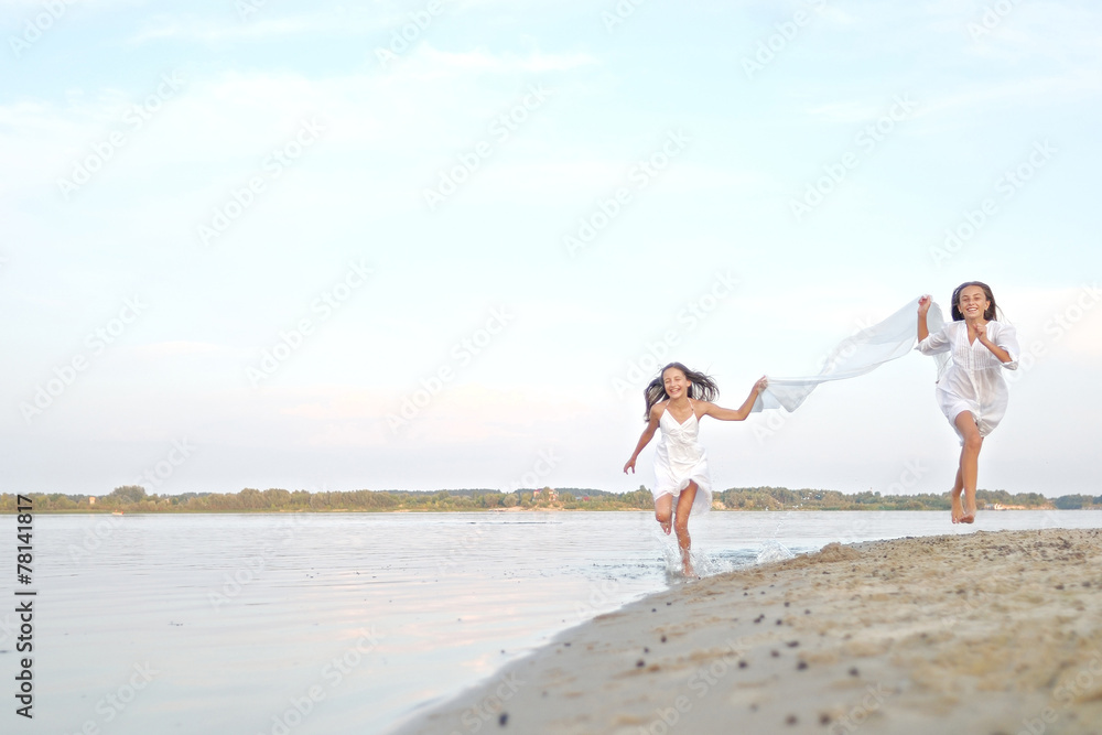 Portrait of two girls on the beach