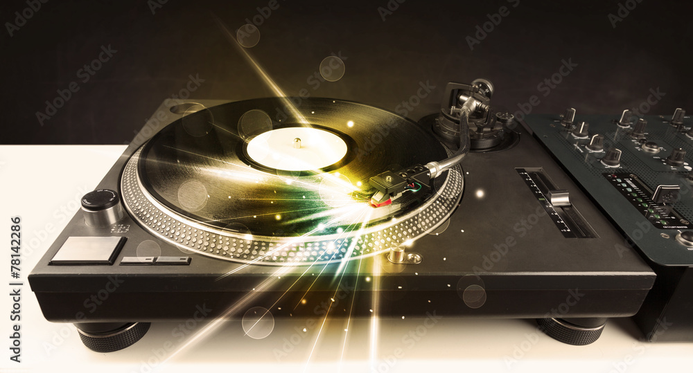 Music player playing vinyl with glow lines comming from the need Music player playing vinyl with glow lines comming from the need