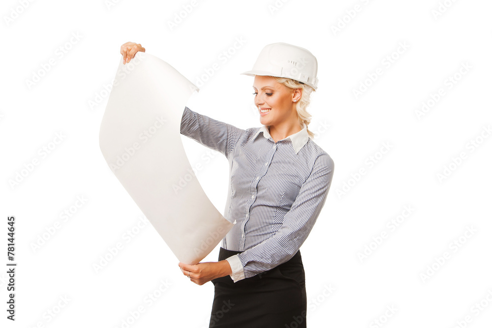 Young female construction specialist looking on blueprints Young female construction specialist looking on blueprints