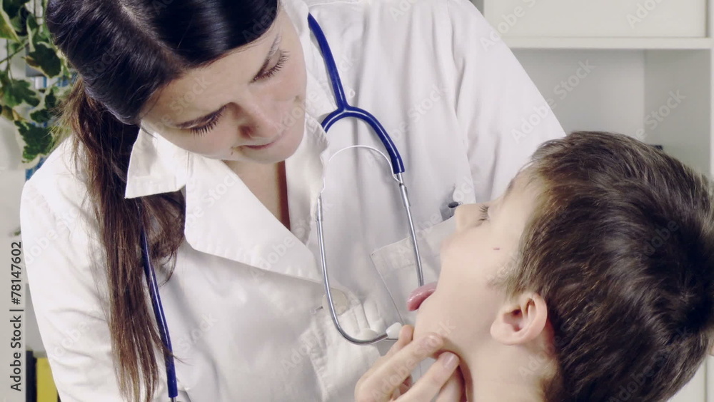 female doctor visiting throat of cute child in hospital female doctor visiting throat of cute child in hospital